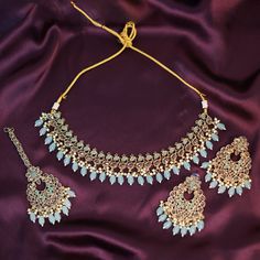 Immerse yourself in the enchanting world of elegance with our Blue Handmade Punjabi Jewelry Set. This exquisite ensemble, inspired by the rich traditions of Indian Bollywood fashion, is a testament to fine craftsmanship and timeless beauty. Perfect for weddings, parties, and engagement celebrations, this high-quality jewelry set is designed to make you stand out on your special day. The necklace, earrings, and tikka in this set are meticulously handmade, showcasing the skillful artistry that goe Elegant Blue Bridal Sets Gift, Elegant Turquoise Wedding Sets, Elegant Hand Set Blue Bridal Earrings, Elegant Blue Hand-set Bridal Earrings, Blue Elegant Bridal Necklace For Formal Occasions, Elegant Light Blue Wedding Sets, Blue Hand Set Jewelry Sets For Wedding, Hand Set Blue Jewelry Sets For Wedding, Blue Hand Set Jewelry For Wedding