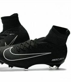 a pair of black and silver nike soccer cleats with white lettering on the soles