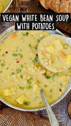 vegan white bean soup with potatoes in a bowl on a wooden table next to bread