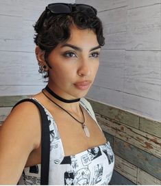 A young woman with short curly hair posing to display her new pixie cut Penny Tovar Short Hair, Earrings For Short Hair Pixie Cuts, Very Short Wavy Hair, Pixie Cut Curly Hair Round Face, Penny Tovar, Curly Short Pixie, Pixie Cut Curly Hair, Black Hair Cuts, Curly Pixie Hairstyles