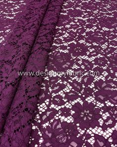 purple lace fabric with white flowers on it