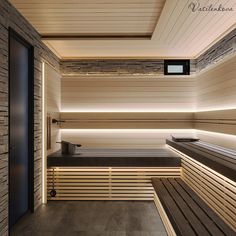 an indoor sauna with wooden benches and lights