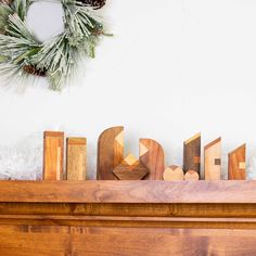 wooden letters sitting on top of a mantle