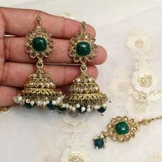 *Light Weight dark gold Adjustable necklace set with earrings and tikka.*Studded with crystal stone.*Light Weight Gold necklace.*Necklace width- 1.4 inches (included pearl drop)*Earrings Length- 2.7 inches(included pearl drop)*Dome size-  1 inches Gold Plated Kundan Necklace With Latkans For Wedding, Gold Plated Stone Work Jhumkas For Wedding, Gold Plated Jhumkas With Stone Work For Wedding, Bollywood Style Gold Plated Jewelry Sets With Stone Work, Bollywood Style Festive Jewelry Sets With Matching Earrings, Green Gold Plated Bridal Earrings For Wedding, Green Gold-plated Bridal Earrings For Wedding, Bollywood Style Gold Plated Jewelry Sets For Diwali, Gold Tikka With Matching Earrings For Festive Occasions