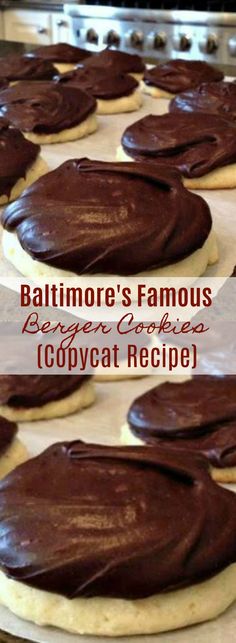 chocolate frosted cookies sitting on top of a cookie sheet