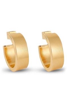 Part California cool, part Italian elegance, these 18-karat gold-plated hollow hoop earrings will lend perfect polish to any look. 1 1/4" hoop diameter; 1/2" width Post back Sterling silver/18k-gold plate Made in Italy Luxury Gold-plated Polished Hoop Earrings, Luxury Gold Plated Polished Hoop Earrings, Classic Yellow Gold Plated Hoop Earrings, Luxury Gold Plated Hoop Earrings With Polished Finish, Luxury Polished Gold-tone Hoop Earrings, Luxury Gold-tone Polished Hoop Earrings, Luxury Gold-tone Hoop Earrings With Polished Finish, Luxury Plated Yellow Gold Hoop Earrings, Italian Elegance