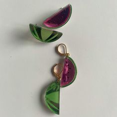 Slice into summer with these watermelon statement earrings! Studs or 14k gold filled huggie – choose your own adventure. Lookin' gorg at 2" – one earring represents a succulent slice, the other the melon's gorgeous exterior. Every piece of jewelry is hand formed and hand assembled by me. Due the unique nature of the product you may not get the pictured earrings. Watermelon Colored Summer Jewelry Gift, Summer Watermelon Colored Jewelry For Gift, Green Teardrop Jewelry For Summer, Handmade Watermelon Colored Jewelry For Gift, Handmade Watermelon-colored Jewelry Gift, Fun Gold Summer Jewelry, Fun Gold Jewelry For Summer, Trendy Round Summer Jewelry, Handmade Watermelon Colored Dangle Jewelry