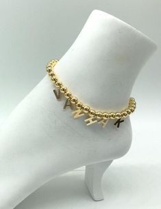 Beautiful trendy gold ball anklet with charms These are gold filled. Will NOT tarnish. Anklet is $40 and each charm is $8 (hence the reason it starts at $48) please add the initials in the order you wanted them placed in the notes section If these are a gift, make sure to request a gift box in the notes section!! Feel free to message me with any questions you have! Gold Name Bracelet With Letter Beads, Trendy Gold Name Bracelet For Personalized Gift, Trendy Personalized Gold Name Bracelet, Trendy Gold Custom Name Bracelet, Trendy Gold Anklet As Gift, Trendy Custom Name Gold Bracelet, Trendy Gold Anklets Perfect For Gifts, Gold Dangle Anklets As Gift, Gold Dangle Anklets For Gift