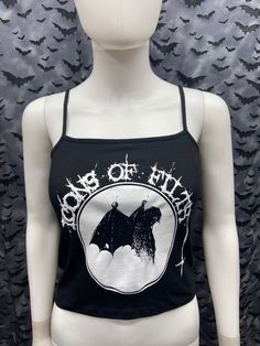 This is a black official Icons of Filth crop tank top with spaghetti straps. This has an Icons image screen printed on the front. 57% cotton/ 38% polyester/ 5% SpandexThese are handmade screenprinted and slightly vary from the photo. Please feel free to email me any questions. Thanks for looking.Due to an influx of incorrect addresses if a package is returned,  you must pay the shipping cost to resend the item to you.I do not do exchanges and I do not take returns unless the item is damaged. I t Hoodie Diy, Crust Punk, Black Cropped Tank, Black Crop Top Tank, Graphic Tank Tops, Crop Tank Top, Pink Tank Top, Black Crop, Black Crop Tops