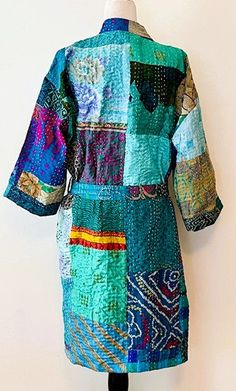 Short Patchwork Cotton Kimono Duster. Expertly designed with quality kantha stitching. This delightful, handmade cotton patchwork kimono is impressive. A full kaleidoscope of colors, blending with all of your basics. Constructed in fresh, quality cotton. Designer influenced and unique. Created as a traditional short kimono with an extra wide front band. Luscious color of turquoise. Can be worn open as a duster jacket or wrapped as kimono. Embroidery is carried through out the garment and finishe Green Traditional Kimono With Patchwork, Traditional Green Kimono With Patchwork, Festival Kimono With Green Patchwork, Festival Green Kimono With Patchwork, Multicolor Cotton Kimono With Patchwork, Multicolor Cotton Patchwork Kimono, Handmade Multicolor Cotton Kimono, Blue Bohemian Kimono With Patchwork, Kimono Embroidery