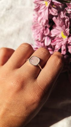 "bell hooks ♀️ 925 sterling silver hammered band ring with a rose quartz stone  ♀️ Finish: Hammered ♀️ Stone Size: 7.5 mm ♀️ Nickel free ♀️ Free shipping in the US \"The function of art is to do more than tell it like it is- it's to imagine what is possible.\"  -- bell hooks ABOUT ROSE QUARTZ Rose quartz is often called the \"Love Stone.\" It's energetic hallmark is that of unconditional love that opens the heart chakra. This makes rose quartz a stone for every type of love: self-love, family, p Rose Gold Crystal Ring With Birthstone In Sterling Silver, Rose Gold Sterling Silver Birthstone Crystal Ring, Rose Gold Rings With Rose Quartz For Gifts, Rose Gold Rose Quartz Jewelry For Anniversary, Nickel-free Sterling Silver Rose Gold Rings, Nickel-free Rose Gold Sterling Silver Rings, Adjustable Rose Quartz Ring, Adjustable Rose Quartz Rose Gold Ring, Rose Gold Gemstone Ring In Sterling Silver