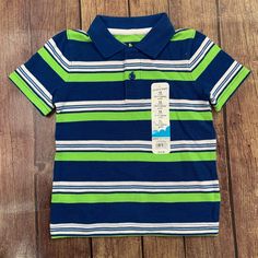 Green, Blue, And White Striped Short Sleeve Polo Shirt. Size 12 Months. Nwt Cute Blue Collared Top, Blue Short Sleeve Tops For Playtime, Blue Short Sleeve Shirt For Playtime, Playful Blue Collared Top, Playful Collared Blue Tops, Playful Fitted Blue T-shirt, Cute Blue Collared Shirt, Cute Fitted Blue Shirt, Blue Shirt For Playtime In Spring