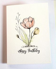 a happy birthday card with two pink flowers