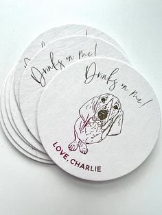 four coasters with the words love charlie and a dog's face on them