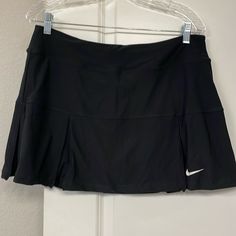 Women’s Nike Tennis/Golf Skirt Nwt. Black. Size L Measurements Waist 16-1/2” Length 14” Sporty Black Tennis Skort, Sporty Black Skort For Tennis, Sporty Black Tennis Skirt, Black Sporty Tennis Skirt, Black Mini Skirt For Sports, Spring Season, Fitted Black Tennis Bottoms, Casual Nike Fitted Tennis Skirt, Sporty Black Pleated Skort, Casual Black Tennis Skirt