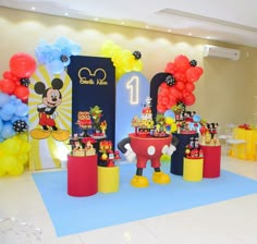 mickey mouse themed birthday party with balloons and decorations