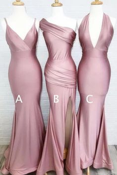 three bridesmaid dresses on mannequins in front of a brick wall