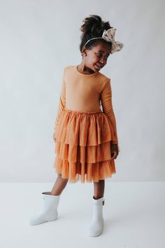 This Pumpkin Rib Dream Tutu DressÂ for girls will make your little one feel like the belle of the fall ball! Bamboo material offers comfort and breathability while the cute and fun tutu design is perfect for twirling around in. Let your little princess show off her pumpkin style all season long! Made from theÂ softest and most breathable seasonal bamboo viscose material,Â your babe won't want to take this off! Designed for extra play and all the sass with our ruffle detail to celebrate in style! Tutu Design, Fall Ball, Tuxedo Accessories, Toddler Flower Girls, Girls Dress Outfits, Toddler Flower Girl Dresses, Infant Flower Girl Dress, Tea Party Dress