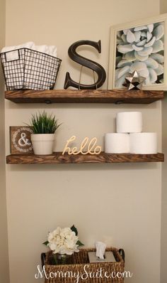 two wooden shelves above a toilet in a bathroom