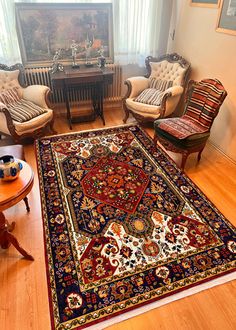 a living room filled with furniture and a rug