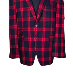 This Chiragh Apparel blazer is an elegant upgrade on dapper tailoring and features rich shades in a sumptuous fabric for elegant opulence. Fashioned from premium quality wool, this plaid check blazer features full lining in Japanese silk, a notch lapel, two-button closure and single-vented back. A left chest pocket and three flap pockets appoint the front while the inside has two (2) pockets on the left and one (1) pocket on the right. A flash of contrast piping is added to the jacket lining ins Formal Red Outerwear With Hidden Button Closure, Red Formal Outerwear With Hidden Button Closure, Red Semi-formal Blazer With Buttons, Elegant Red Tweed Jacket For Formal Occasions, Red Formal Suits With Button Closure, Classic Red Tweed Jacket For Formal Occasions, Red Single Button Formal Blazer, Red Fitted Blazer With Hidden Button Closure, Elegant Red Blazer With Button Closure