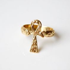 This 18k solid Gold antique detailed Ankh cross ring is reminiscent adorned treasure. Can be custom ordered in 18k or 14k white rose or yellow gold. The Ankh, Signified wisdom and insight on the highest level, symbolizing the divine bestowal of eternal life. Widely used as an amulet in Ancient Egypt. From the spiritual point of view the ankh represented the key to all hidden knowledge. Sizing included Custom orders welcomed! Free worldwide shipping To see more.... To more necklaces and pendants: Snake Ring Gold, Hidden Knowledge, Eye Band, Ankh Cross, Dainty Diamond Ring, Life Ring, Mystical Jewelry, Egyptian Jewelry, Cross Ring