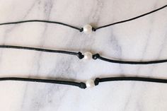 100% vegan pearl choker with your choice of 1mm dainty black cotton cord, 2mm black cotton cord or super soft 3mm vegan suede Choker is 13 inches with a 2 inch adjustable extender chain Looking for a different length? Message me for a custom necklace! Handmade with love by Amanda **please read my shop's policies** Thanks for viewing! 🐚 Minimalist Choker With Adjustable Length, Adjustable Minimalist Choker, Adjustable Length Minimalist Choker, Amanda Rose, Henderson Nv, Handmade Gift Tags, Pearl Choker, Choker Necklaces, Cotton Cord