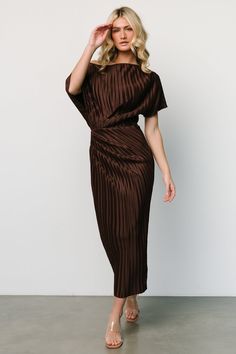 Baltic Born exclusive style Classy chocolate brown color Material has some stretch Asymmetrical high neckline Draped off one shoulder design  Short sleeves with raw edge Elastic waistband Formfitting style Ruched on right side Small slit in back with raw hem Lined skirt 100% Polyester Skye is 5'9, cup size 32A, size 0 and wearing size S Semi Formal Wedding Attire, Fall Cocktail Dress, Brown Bridesmaid Dresses, Baltic Born, Fall Wedding Guest Dress, Guest Attire, Wedding Attire Guest, Shower Dresses, Pleated Midi Dress