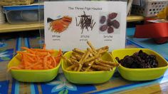 three bowls filled with different types of food next to a sign that says the tiny finger foods