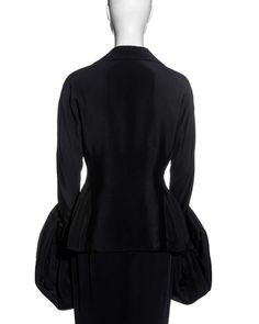 For Sale on 1stDibs - ▪ Yohji Yamamoto black silk suit skirt ▪ Single-breasted jacket ▪ Detachable voluminous padded cuffs ▪ Ankle-length skirt with back kick split ▪ SIZE JP Black Fitted Long Sleeve Skirt Suit, Elegant Black Long Sleeve Skirt Suit, Black Long Sleeve Skirt Suit For Evening, Fitted Black Silk Outerwear, Fitted Silk Outerwear For Evening, Black Long Sleeve Skirt Suit For Party, Black Silk Long Sleeve Blazer, Elegant Black Cocktail Blazer, Classic Long Sleeve Evening Skirt Suit