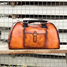 Ideal for overnight or weekend trips, the travel duffle is the best option to carry all your essentials in style. There’s virtually no place where a leather duffel bag would feel awkward or out of place. It measures 21.6 x 11.8 x 11.0 inches / 55 x 30 x 28 cm and features an outside pocket perfect for the little items that could otherwise get lost at the bottom of your bag, full lined interior and a removable shoulder strap. THE DETAILS: Materials: cognac painted calf + black painted calf Lining Designed Shoes, Leather Duffel Bag, Eco Bags, Leather Duffel, Custom Design Shoes, Travel Duffle Bag, Hot Style, Travel Duffle, Duffle Bag Travel