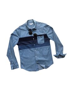 "Description: Used and pre-owned authentic vintage denim shirts, long sleeves, patched pockets, featuring patchwork of three different fabrics and color shade as seen. Once those three shades were combined to each other, it came out such a cool, vintage, trendy, and unique patchwork denim shirts as pictures shown. There's only one unique item you can find here to wear on every occasion, especially for your casual outfit. See measurements below. If it fits you, please don't miss it! Features:  - Vintage patchwork mixture of denim and cotton shirts. - Perfect combination of different color shades. - Patched pocket. - Unique design. Size: L (on tag) - Length (centre of back neckline to bottom): 28.5 - 29\" - Armpit to armpit: 40 - 41\" - Shoulder to shoulder: 17.5\" - Sloped Sleeves (Above sh Blue Long Sleeve Shirt With Patch Pockets, Blue Denim Shirt With Patch Pockets, Blue Shirt With Patch Pockets For Spring, Blue Spring Shirt With Patch Pockets, Spring Blue Shirt With Patch Pockets, Blue Long Sleeve Top With Patch Pockets, Long Sleeve Cotton Shirt With Patchwork, Cotton Long Sleeve Shirt With Patchwork, Cotton Long Sleeve Shirt With Patches