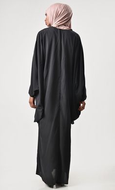 A perfect wardrobe piece for festive season Round neck Embroidered motif on shoulder with tassle Batwing Sleeves FABRIC: Nida CARE: Machine wash cold Oversized Black Abaya, Oversized Long Sleeve Black Abaya, Oversized Black Long Sleeve Abaya, Black Oversized Long Abaya, Oversized Black Long Abaya, Black Long Sleeve Agbada For Eid, Long Sleeve Black Agbada For Eid, Elegant Black Agbada For Eid, Black Tunic Abaya For Eid