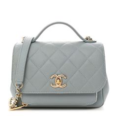 This is an authentic CHANEL Caviar Quilted Small Business Affinity Flap in Light Blue. This classic handbag is crafted of grained caviar leather in light blue. The shoulder bag features a blue leathertop handle, a leather threaded gold shoulder strap with a shoulder pad, a rear patch pocket, anda gold ChanelCC turn clock. The flap opens to a leather interior with zipper and patch pockets. Flap Bag With Cc Turnlock Closure For Shopping, Classic Blue Bag With Cc Turnlock Closure, Top Handle Flap Bag With Cc Turnlock For Shopping, Shopping Flap Bag With Cc Turnlock And Top Handle, Chic Blue Bag With Cc Turnlock Closure, Blue Leather Shoulder Bag With Cc Turnlock Closure, Blue Luxury Flap Bag For Formal Occasions, Luxury Blue Flap Bag For Formal Occasions, Blue Shoulder Bag With Cc Turnlock Closure