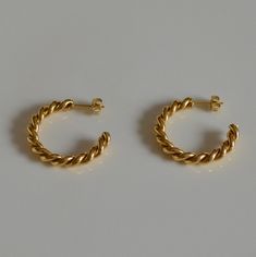 These are hoop earrings made from 18k gold plated stainless steel. Allergy-free earrings are good for your sensitive ear skin. The earrings with a twisted rope design that looks like two strands are intertwined. Twist earrings require very high craftsmanship and are a very time-consuming product. It is worth being part of your jewelry collection. This minimalist and stylish design are perfect for your everyday dress, like a white t-shirt and denim jeans, or a black elegant dress. Twisted Rope ea Stainless Steel Yellow Gold Hoop Earrings Gift, Everyday Yellow Gold Stainless Steel Hoop Earrings, Small Hoop Earrings In Yellow Gold Stainless Steel, Small Yellow Gold Hoop Earrings In Stainless Steel, Small Yellow Gold Stainless Steel Hoop Earrings, Yellow Gold Small Hoop Earrings In Stainless Steel, Yellow Gold Stainless Steel Hoop Earrings, Yellow Gold Stainless Steel Small Hoop Earrings, Black Elegant Dress