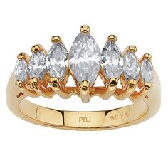 PRICES MAY VARY. 7 Cubic Zirconias 1.50 cttw 18k Gold-Plated Measures: 21 mm wide x 7 mm long x 7 mm high; Shank Width: 2.0 mm wide Includes gift box and drawstring pouch PalmBeach Jewelry exclusive. 1.50 carats T.W. of marquise-cut cubic zirconia give this graduated ring the elegance and luxury you've been looking for, at a very affordable price. 18k gold-plated or platinum-plated sterling silver. - 1029210 Brass Engagement Ring, Fake Engagement Rings, Womens Rings, Cubic Zirconia Engagement Rings, Stone Engagement Rings, Engagement Anniversary, Jewelry Online Shopping, Marquise Cut, Anniversary Ring