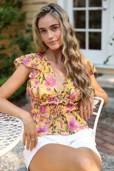 Ruffle blouses are a stylish and feminine addition to any wardrobe. With delicate ruffles and a range of designs, from classic to trendy, these blouses offer a versatile option for both casual and formal occasions. Whether you prefer a flowy and bohemian look or a more structured and sophisticated style, there's a ruffle blouse to fit your unique taste. Shop now to find your perfect ruffle blouse and add a touch of elegance to any outfit. Ruffled Blouse Outfit, V Neck Collar, Cap Sleeves Blouse, Ruched Top, Bohemian Look, Ruffled Sleeves, Blouse Outfit, Ruffle Sleeves, Low Iron