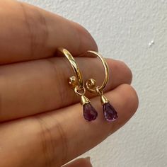 Dainty vintage 14K yellow gold natural amethyst briolette dangle earrings for everyday wear. The earring is about 23mm long in length. The amethyst charms can be removed as well. They are perfect two in one earrings --Details--- Metal: 14K yellow gold Stone: natural amethyst Era: Original vintage Condition: Excellent Stamp: 14K The item will come with a jewelry pouch. Gold Amethyst Earrings, Classy Earrings, Purple Earrings, Amethyst Jewelry, Gold Stone, Amethyst Earrings, Fantasy Jewelry, Jewelry Pouch, Charm Earrings