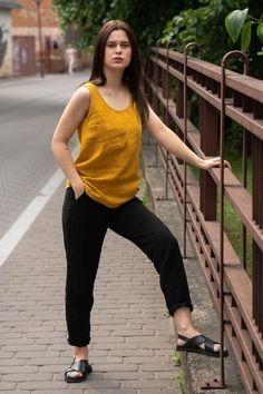 A young woman posing outside in the city street wearing spicy yellow linen blouse and pure black linen pants dakota. Mustard Yellow Top, Mustard Yellow Color, Linen Collection, Linen Tank Top, Spring Clothes, Skirts Midi High Waisted, Linen Tank, Perfect Partner, Blouse For Women