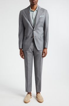 This Italian-crafted suit done in a single-breasted silhouette is tailored from wool and fashioned with notched lapels for a comfortable, polished look. Jacket has three-button closure; notched lapels; chest welt pocket; welt ticket pocket; front flap pockets Trousers have zip fly with button closure; front slant pockets; back welt pockets Partially lined 100% wool Dry clean Made in Italy Designer Clothing Suit With Notch Lapel And Button Closure, Tailored Wool Suits For Semi-formal Occasions, Tailored Three-piece Suit With Notch Lapel And Pressed Crease, Timeless Semi-formal Wool Suits, Tailored Wool Three-piece Suit With Suit Collar, Tailored Flat Front Suit With Button Closure, Tailored Button Closure Suit With Flat Front, Bespoke Wool Suit With Notch Lapel, Tailored Notch Lapel Pantsuit With Concealed Placket