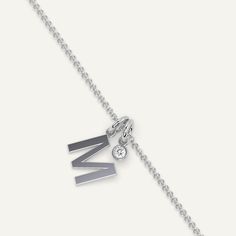 A personalized initial necklace design featuring a letter M pendant. This beautiful women's letter necklace is approx. 1cm tall and comes in solid 14k white or yellow gold with an optional 0.05 carat (3mm) diamond and an adjustable 16 inch - 18 inch chain. Letter M Necklace, Letter K Necklace, Necklace Gold Diamond, M Initial, K Necklace, J Necklace, M Necklace, Pendant For Women, Necklace Design