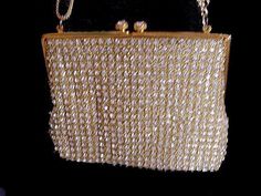 "EASY LAYAWAY IS AVAILABLE A gorgeous all rhinestone evening bag hand made in Hong Kong from the early '60s The prong-set sparkling rhinestones are set on a background of twisted gold metallic threads which makes for a stunning combination - today's rhinestones do not compare to the sparkle and intensity of vintage rhinestones - the clasp is 2 huge rhinestones which are just gorgeous There is a gold satin lining with a small pocket for a mirror or some money - there is some light soiling on the Crystal Embellished Evening Bag For Gift, Gold Sparkling Bag As Gift, Elegant Handmade Evening Bag For Celebration, Gold Sparkling Bag For Gift, Gold Sparkling Bags For Gifts, Gold Sparkling Bags Perfect As Gifts, Glamorous Rhinestone Evening Bag Gift, Victorian Gold Bag As Gift, Elegant Rhinestone Evening Bag As Gift