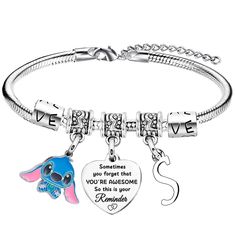 a silver bracelet with an elephant and heart charm on the clasp, saying believe you forgot that you're awesome so this is your grandma