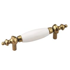 an antique style brass and white door handle