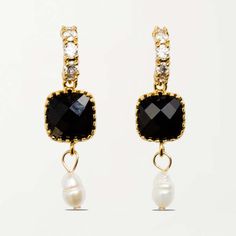 These are the earrings to wear to any party or celebration. whether it's a gala or a birthday dinner they are sure to elevate any outfit. stack these earrings with sparkly studs or wear them on their own.    composition    - white freshwater pearls  - black glass gems  - 14k gold plated brass    about the style    - black and white pearl earrings with diamonds that are perfect for special occasions  - black and white pearl earrings that can be dressed up or down  - black and pearl earrings with Single Earring For Evening Wear, Clip-on Drop Earrings For Evening, Chic Crystal Dangle Earrings For Evening, Dangle Crystal Earrings With Plating For Party, Chic Evening Crystal Dangle Earrings, Party Crystal Dangle Earrings With Plating, Party Dangle Crystal Earrings With Plating, Glamorous Single Clip-on Earring For Evening, Chic Dangle Clip-on Earrings For Party