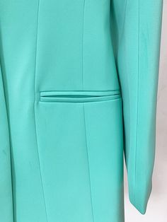 Imelda Green Oversized Blazer for Women - Slim Fit The women's oversized blazer that can be worn as a dress is available in black and Teal green, featuring a peak collar and single-button design for a professional and stylish look. It includes two faux pockets and big shoulder pads, adding sophistication to the garment. This versatile dress can be worn to both the office and special events. The high-quality lining ensures comfort throughout the day. With its knee-length cut, it adds a modern and Office Wear Solid Color Notch Lapel Blazer, Spring Office Blazer Dress With Notch Lapel, Spring Formal Notched Outerwear, Classic Solid Color Notch Lapel Blazer, Notch Lapel Solid Color Blazer For Work, Business Blazer With Notch Lapel In Solid Color, Spring Office Blazer Dress With Single Button, Spring Career Blazer In Solid Color, Spring Tailored Solid Blazer Dress