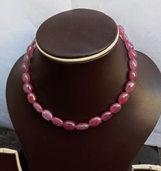 Natural Pink Ruby Oval Beads AAA+ 213 Carat 11'' Fine Quality gemstone Pink Ruby adjustable cord Necklace Stone : Natural Pink Ruby Shape :- Smooth Oval Size - 9x10 -10x14mm 213 carat 11'' inch Necklace Polish :- Handmade Purity :- AAA+ color - Pink makes a great gift for your loved ones. It is known as the 'love stone' as the message it emits is the strong vibration of unconditional love, joy, warmth and healing. As quartz crystals are profound amplifiers of energy, it may help to kindle happin Adjustable Oval Jewelry With Faceted Beads, Adjustable Gemstone Necklace With Oval Beads, Adjustable Oval Beads Gemstone Necklace, Adjustable Necklace With Gemstone Oval Beads, Adjustable Oval Gemstone Beaded Necklaces, Adjustable Oval Beaded Necklace, Adjustable Oval Necklace With Natural Stones, Oval Single Strand Beaded Necklace As Gift, Oval Single Strand Beaded Necklace For Gift