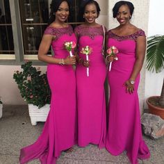 three women in pink dresses standing next to each other