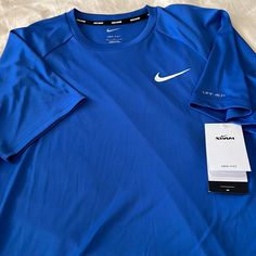 Brand New. Never Worn. Tags Attached. Nike Swim Tee Shirt. Short Sleeve. 100% Polyester With Upf 40+ Protection. Super Fast Line Dry. Generous Medium Fit. Armpit To Armpit 22”. Length 28”. Royal Blue. Nike Short Sleeve Relaxed Fit Shirt, Nike Relaxed Fit Short Sleeve Shirt, Nike Short Sleeve Shirt With Moisture-wicking, Blue Moisture-wicking Short Sleeve Shirt, Blue Sporty Shirt With Relaxed Fit, Blue Sporty Relaxed Fit Shirt, Blue Relaxed Fit Sporty Shirt, Nike Blue Short Sleeve T-shirt, Nike Blue Crew Neck Shirt