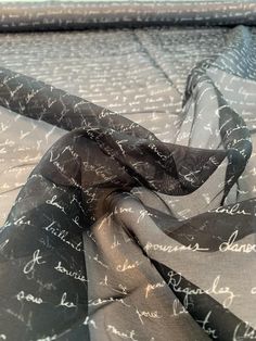 This love letters in French printed silk organza designer fashion fabric in black and off-white is a tribute to the lost art of letter writing. SKU: 8725 Content: 100% Silk Color: Black / Off-White Width: 53 inches This fabric is a last cut and no longer in production. Once sold out, we are unable to get more. Art Of Letter Writing, Off White Designer, Diy Crown, Black Liquid, Lost Art, Silk Organza, Printed Silk, Letter Writing, Fashion Fabric